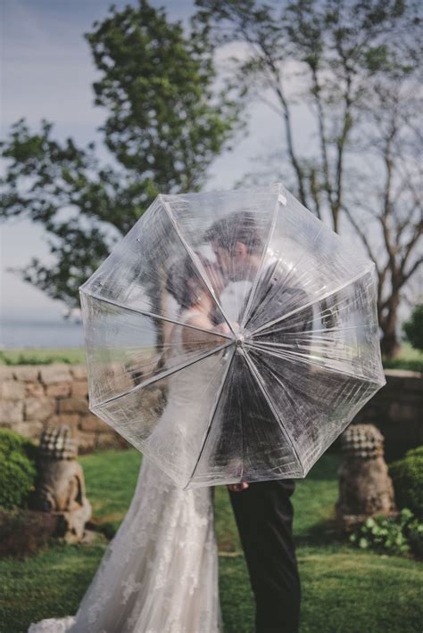 bride with umbrella|clear umbrella wedding photos.